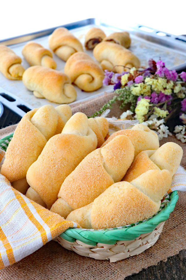 Bread rolls on a bread basket.