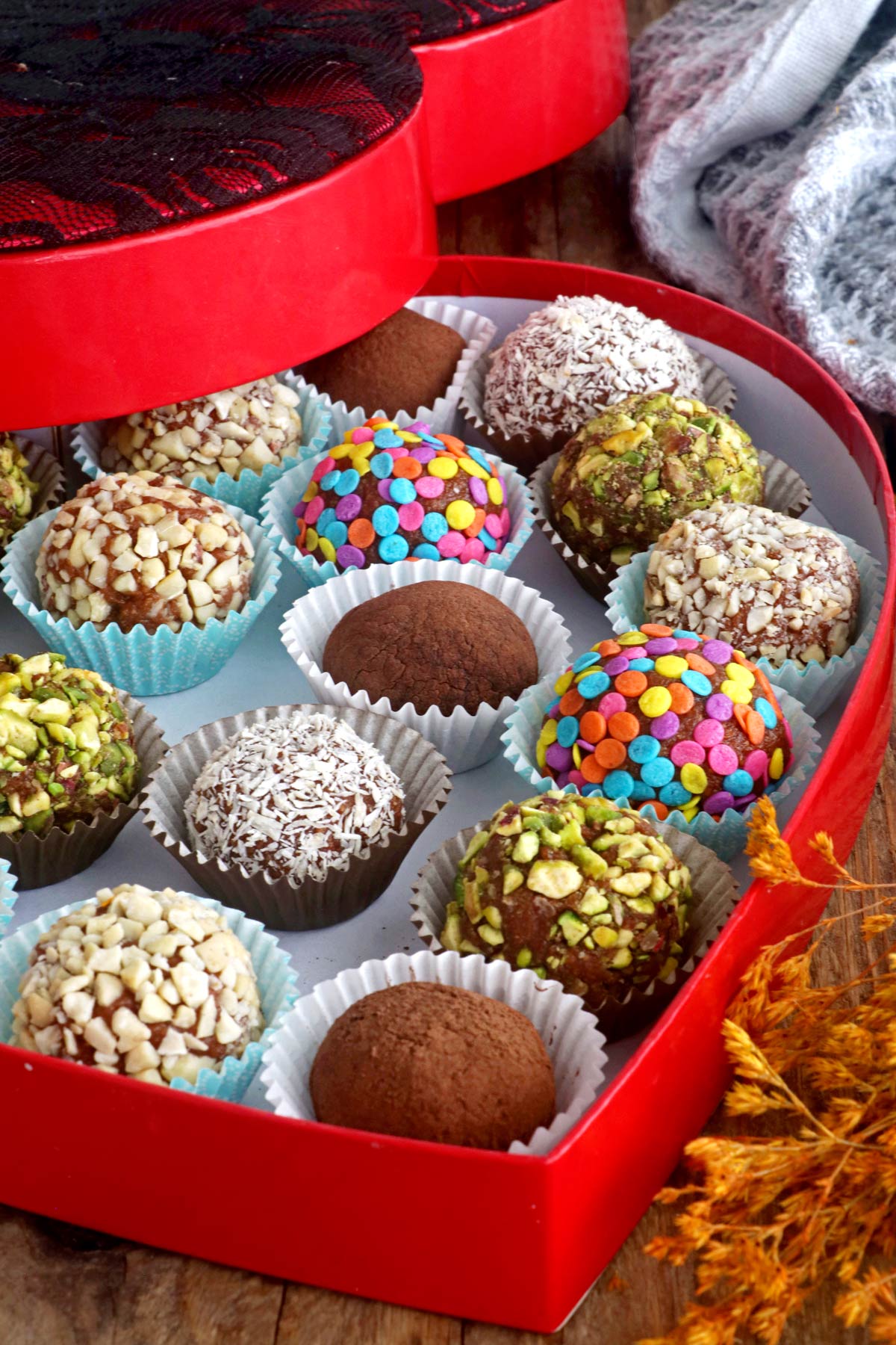 Assorted coated graham balls in a gift box.