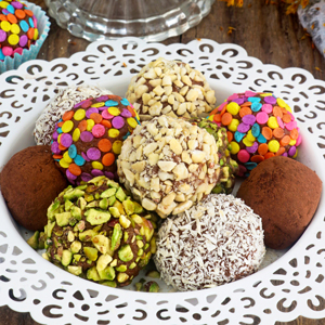Graham balls in a serving plate with assorted coating.