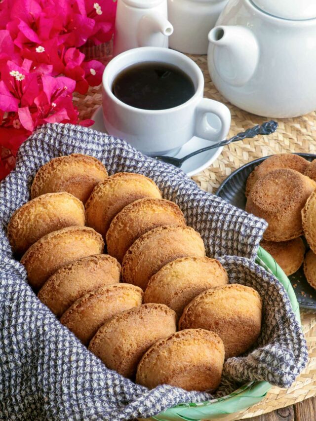 Freshly baked Mamon Tostado in a bread basket served with hot coffee.